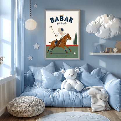 A vertical storybook-style art print of Babar the Elephant playing polo. Babar is riding a chestnut brown horse, wearing a white jersey with the number 3, a red bow tie, and a navy riding helmet. He holds a polo mallet in one hand. The horse has navy and white striped leg wraps. The background features a green field, a red horizon line, and two green cypress trees under a cream sky. The top reads "BABAR fait du polo" with a gold crown.
