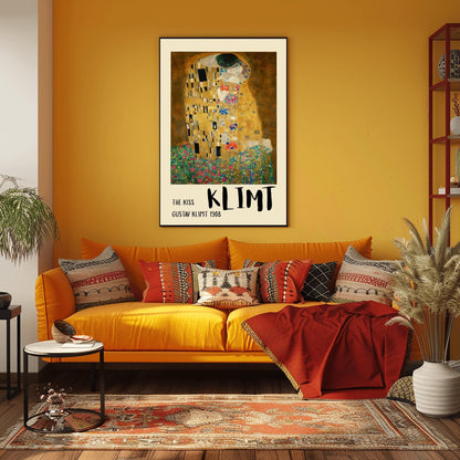 A vertical fine art print of "The Kiss" by Gustav Klimt. Two lovers are shown in an intimate embrace, their bodies covered in elaborate, decorative gold robes. The man's robe features black and white geometric shapes, while the woman's features colorful floral circles. They kneel on a lush bed of colorful wildflowers against a dark, shimmering gold background. The style is rich in mosaic-like patterns and Art Nouveau ornamentation.