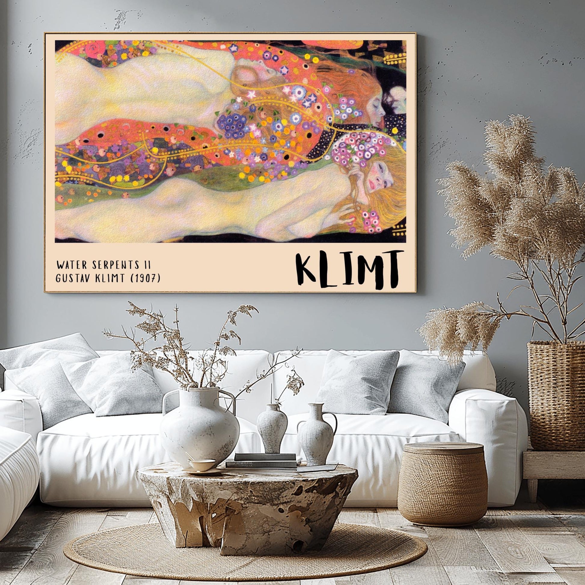 A horizontal museum exhibition poster featuring Gustav Klimt's 1907 painting "Water Serpents II." Reclining female figures are surrounded by a sea of golden spirals, blue and purple flowers, and ornate patterns. The bottom border is cream with bold black text reading "WATER SERPENTS II" and "KLIMT."