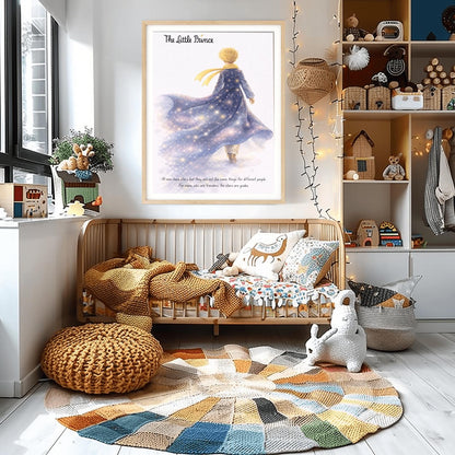 A vertical illustration poster titled "The Little Prince" in elegant script. A young boy with golden hair and a yellow scarf is seen from behind, walking into a white, misty background. He wears a long blue coat that looks like a starry galaxy, filled with glowing stars and purple nebulae. At the bottom, a quote about stars being guides for travelers is written in a simple black font.