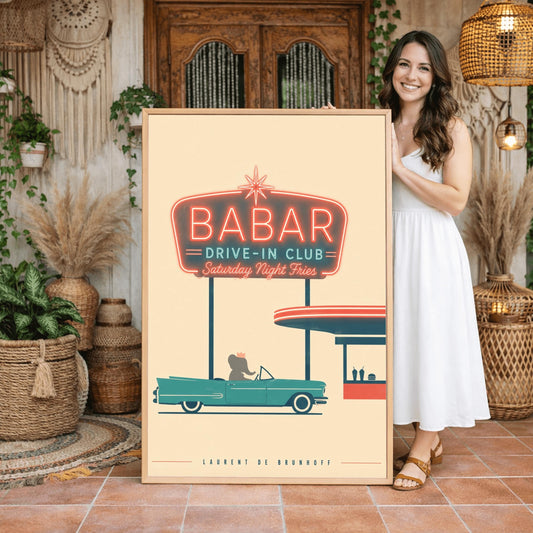 A minimalist graphic vintage-style poster on a solid cream background. At the top, a large retro neon-style sign glows with a red border and teal lettering that reads "BABAR DRIVE-IN CLUB - Saturday Night Fries". Below the sign, a silhouette of a cartoon elephant wearing a crown sits inside a classic teal 1950s convertible car. The car is parked next to a simplified red and teal drive-in order window featuring two milkshakes and a burger silhouette.