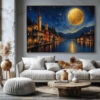 A horizontal art print in a decorative mosaic style inspired by Gustav Klimt. A charming lakeside village with warm-lit windows and tall church spires sits along the edge of dark blue water. A massive, glowing golden moon with heavy texture hangs in a starry night sky. The light from the moon and the town reflects in long, shimmering streaks on the water. The mountains in the distance are shaded in soft blues and purples.