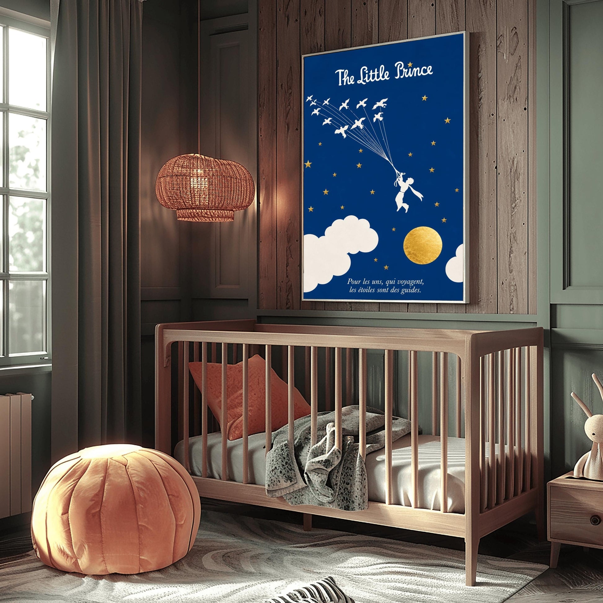 A vertical art print with a deep indigo blue background. A small white silhouette of a boy, the Little Prince, is being pulled upward by a flock of white birds on long strings. The sky is filled with small gold stars and large white clouds at the bottom, next to a textured gold moon. The title "The Little Prince" is at the top in white script, and a French quote is at the bottom in white italics.