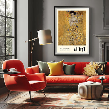 A vertical museum exhibition poster of Gustav Klimt's 1907 "Portrait of Adele Bloch-Bauer I." A woman is shown encased in a lavish gold dress with eye and triangle patterns against a shimmering gold mosaic background. The bottom border is cream with bold black text reading "ADELE BLOCH-BAUER I" and "KLIMT."