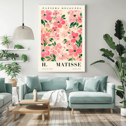 A vertical art print styled as a Henri Matisse exhibition poster. The central image is a dense pattern of soft pink and rose-colored flowers with dark green leaves on a cream-colored background. The flowers are painted with visible, textured brushstrokes. Above the image, the words "PAPIERS DÉCOUPÉS" are written in a black serif font. Below the image, the text reads "H. MATISSE" in large letters, with "ECOLE DE PARIS" and "FRANCE 1890" in smaller text at the bottom.