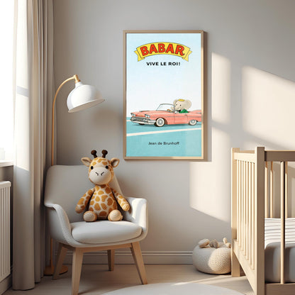 A vertical children's illustration poster. At the top, a yellow banner reads "BABAR" in red letters, with "VIVE LE ROI!" written in black below it. At the bottom, King Babar in a green suit and crown is driving a large, salmon-pink vintage convertible car with white tires. The car is on a simple blue road with white lines, and the background is a solid light blue sky. The name "Jean de Brunhoff" is at the bottom.