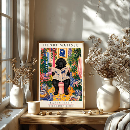 A vertical vintage-style art exhibition poster titled "HENRI MATISSE" at the top and "PARIS 1953 BERGGRUEN & CIE" at the bottom. The main image shows a large, fluffy black Newfoundland dog sitting on a pink toilet in a highly decorated bathroom, reading a newspaper. The room is filled with yellow pattern tiles, blue-and-white wallpaper, a blue Matisse cutout art frame on the wall, multiple large green houseplants, and vases filled with colorful pink flowers.