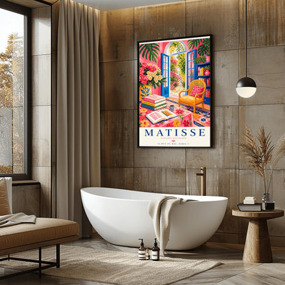 A vertical maximalist art print styled as a Henri Matisse exhibition poster. The scene shows a vibrant interior reading room with hot pink walls and cobalt blue French doors open to a sunlit garden. A yellow cane chair sits next to a bookshelf. In the foreground, a table covered in a pink floral cloth holds a stack of art books, an open book, and a blue coffee mug. Large monstera leaves and various flowers frame the room. Bold black and red text at the bottom reads "MATISSE PAPIERS DÉCOUPÉS"