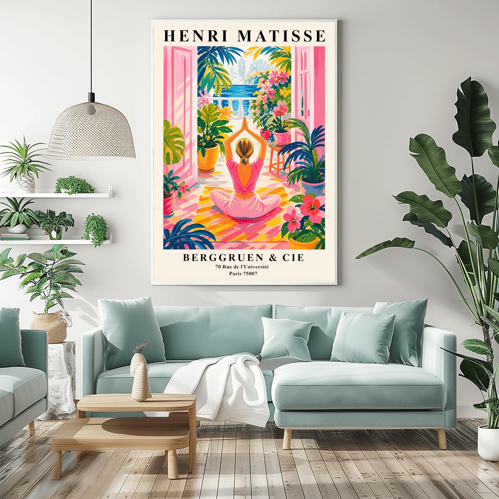 A vertical maximalist art print styled as a Henri Matisse exhibition poster. A woman with blonde hair tied back is seen from behind, sitting on a yellow-and-orange striped yoga mat in a yoga pose with her hands joined above her head. She faces open pink French doors that lead to a balcony with a view of a blue sea and a distant city. The terrace is filled with vibrant pink flowers, large green tropical plants in yellow pots, and a small wooden stool.
