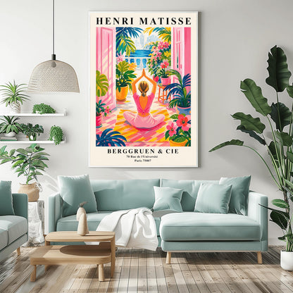 A vertical maximalist art print styled as a Henri Matisse exhibition poster. A woman with blonde hair tied back is seen from behind, sitting on a yellow-and-orange striped yoga mat in a yoga pose with her hands joined above her head. She faces open pink French doors that lead to a balcony with a view of a blue sea and a distant city. The terrace is filled with vibrant pink flowers, large green tropical plants in yellow pots, and a small wooden stool.