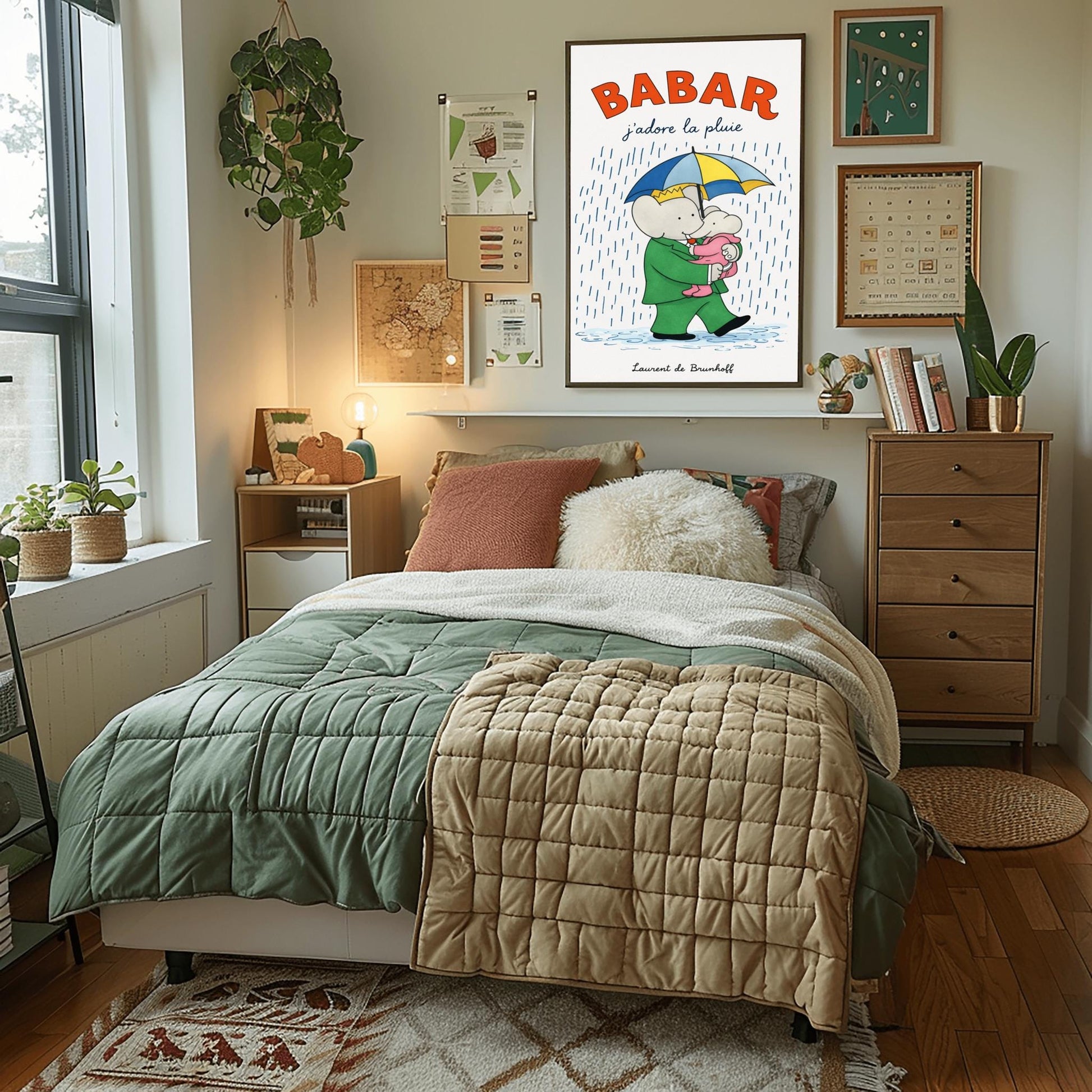 A vertical children's illustration poster titled "BABAR: j'adore la pluie" in orange and blue. King Babar, in a green suit and crown, is walking through the rain while holding a blue and yellow striped umbrella. He is carrying a small elephant wearing a pink rainsuit. They are walking through light blue puddles on a white background. The name "Laurent de Brunhoff" is at the bottom.