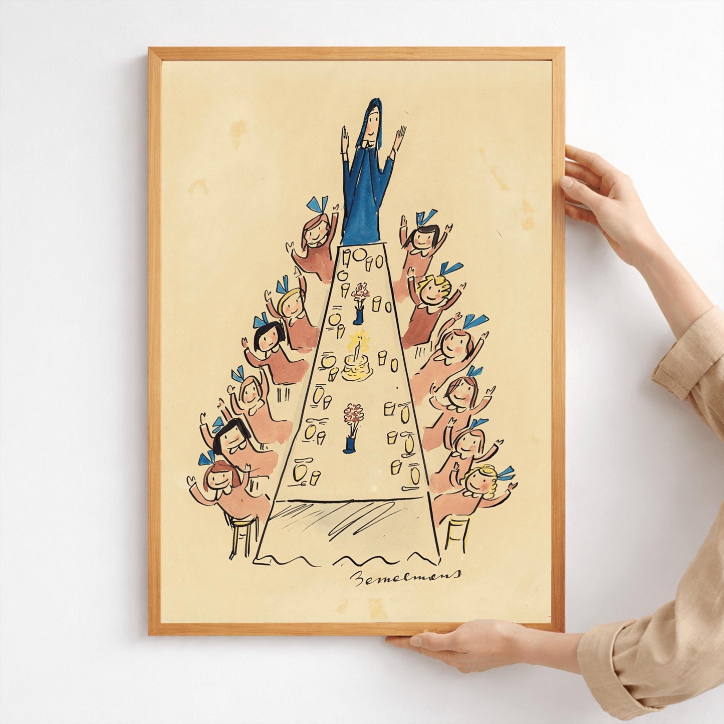 A vertical ink and watercolor illustration by Ludwig Bemelmans showing a festive gathering. A long dining table stretches from the foreground to the back of the room, topped with a birthday cake with one lit candle and small flower arrangements. Miss Clavel, dressed in a blue habit, stands with her arms raised at the head of the table. Along both sides of the table, little girls in pink dresses and blue hair bows wave their hands joyfully. Signed "Bemelmans" at the bottom center.