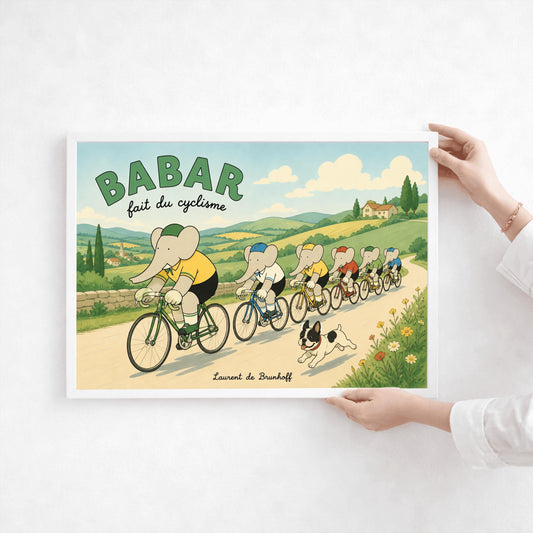 A horizontal children's art print of six elephants riding bicycles in a line down a country road. Babar leads the group in a yellow jersey and green cap on a green bike. The other elephants wear various colored jerseys. A small black-and-white French Bulldog runs alongside them. The background features rolling green hills, a small village, and cypress trees under a light blue sky with soft clouds. Bold green text at the top reads "BABAR" with "fait du cyclisme" in script below.
