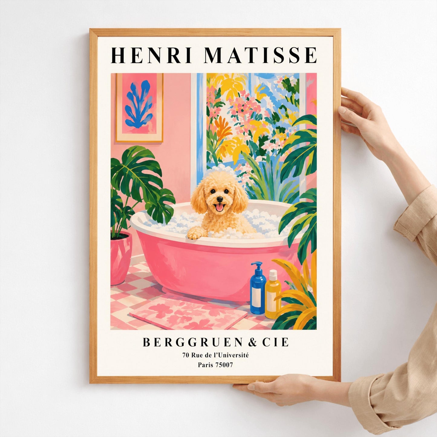 A vertical fine art exhibition poster in the style of Henri Matisse featuring a wide cream border. Bold black text reads "HENRI MATISSE" at the top and "BERGGRUEN & CIE" with a Parisian address at the bottom. The central painting shows an apricot toy poodle dog sitting in a pink bubble bath surrounded by a pink checkered floor, a monstera plant, and a large window overlooking colorful yellow and pink garden plants.