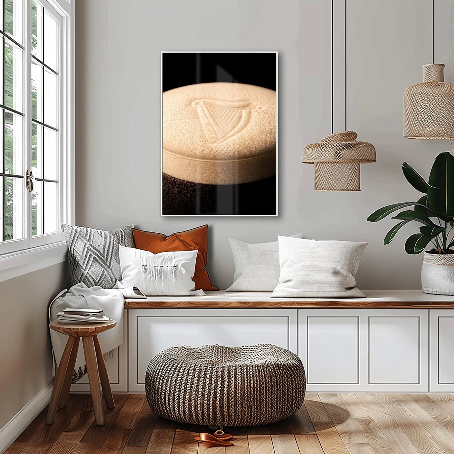 A vertical macro photograph of the thick, creamy foam head on a pint of Guinness. The iconic Guinness harp is embossed into the center of the velvety bubbles. The image features warm cream tones against a dark, shadowy background.