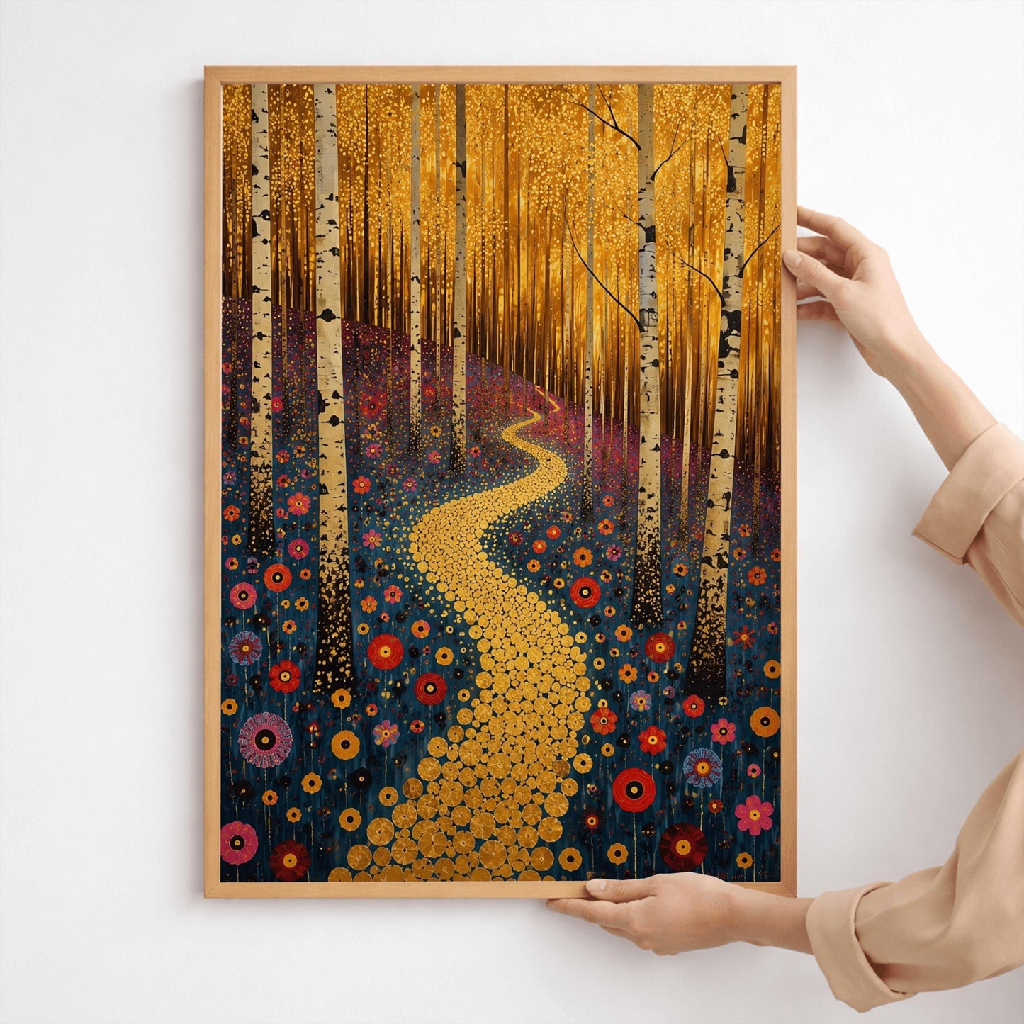 A vertical canvas landscape painting in the style of Gustav Klimt. A winding path made of small, glittering gold circular mosaic tiles snakes from the foreground up a forest hill. Slender white and black birch tree trunks stand vertically across the landscape. The hillside ground is dark navy blue and covered in round, target-shaped flowers in shades of red, orange, and pink. The top third of the painting is a dense, shimmering canopy of tiny golden-yellow autumn leaves.