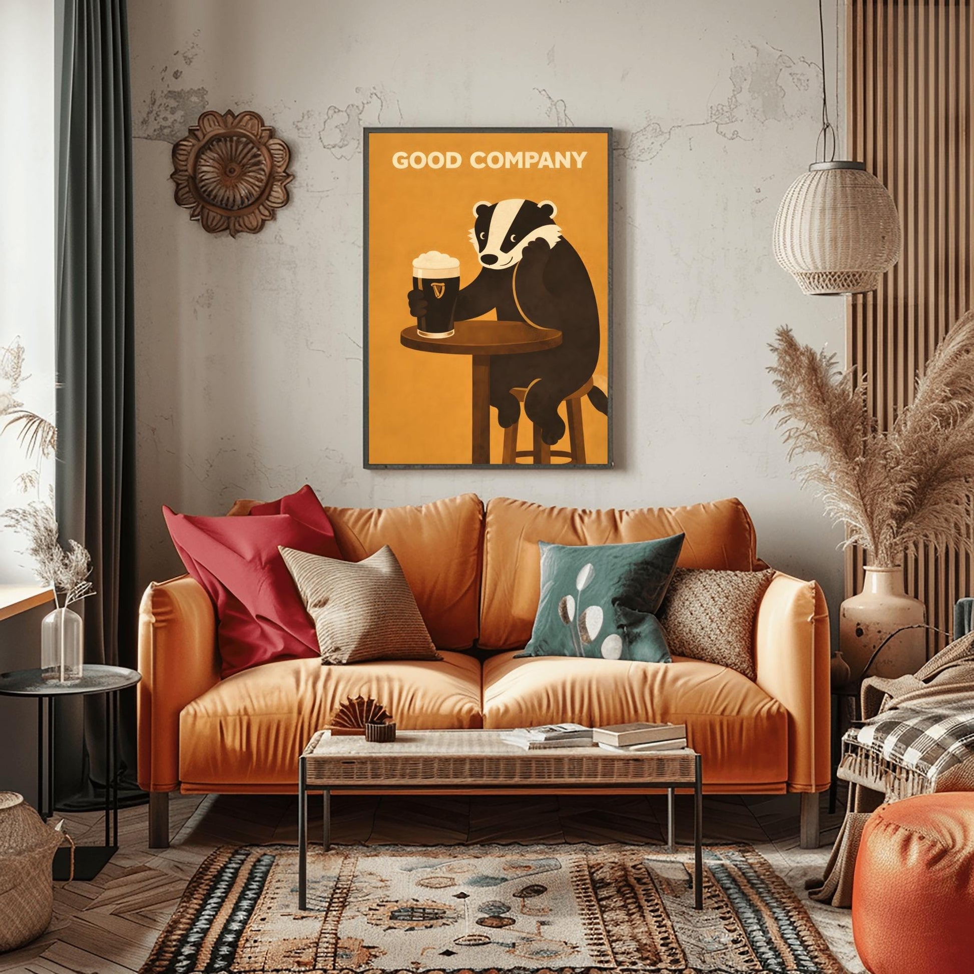 A vertical modern illustration of a cute black and white badger sitting at a round wooden bar table. The badger is leaning on one arm and holding a pint of Guinness with the other. The text "GOOD COMPANY" is written in bold at the top against a warm amber background.