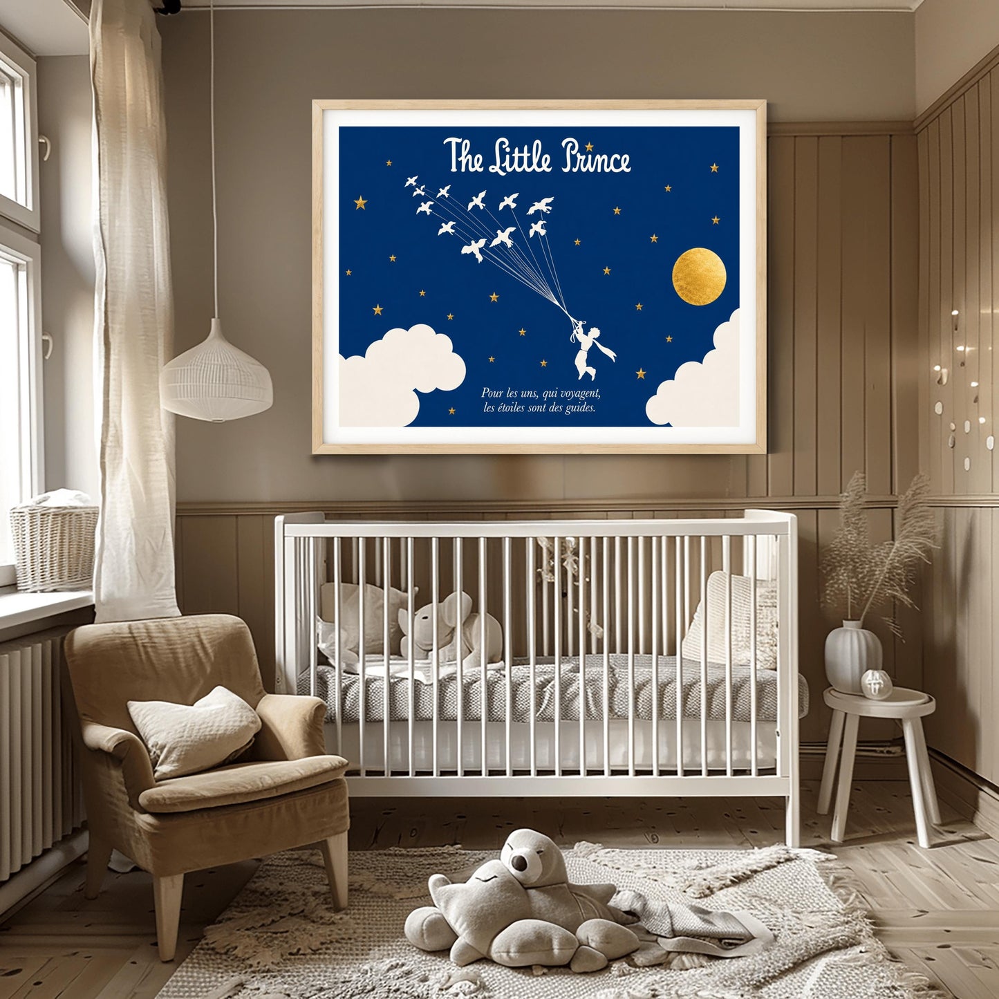 A horizontal illustration of the Little Prince flying through a navy blue night sky. In the center, a white silhouette of the prince holds onto a cluster of fine strings attached to a flock of twelve white wild birds flying upwards and to the left. The sky is filled with small gold stars and features a large, textured gold circular moon on the right, with soft white clouds along the bottom edges