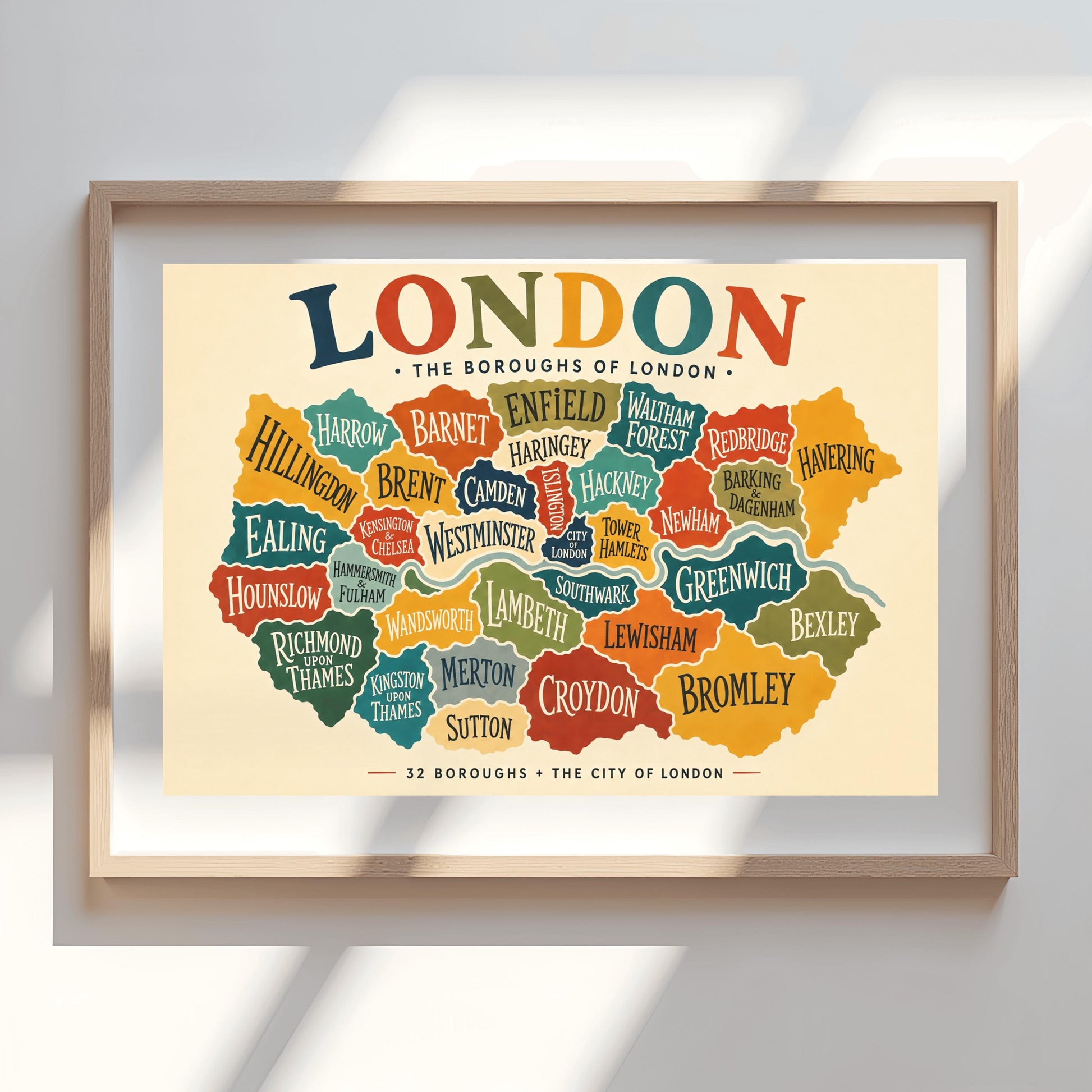 A horizontal vintage-style fine art exhibition poster mapping the boroughs of London. Set on a warm cream background with a wide border, the poster features a colorful, interlocking map of London's districts in shades of teal, orange, green, and yellow, with the River Thames running through the middle. A large, multicolored heading at the top reads "LONDON" and text at the bottom reads "32 BOROUGHS + THE CITY OF LONDON".