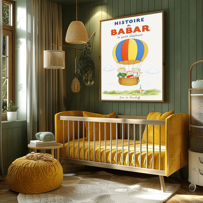 A vertical vintage-style storybook poster on an off-white background titled "HISTOIRE de BABAR le petit éléphant" in bold blue and orange font. The illustration features a large hot air balloon with yellow, blue, and orange stripes floating in a sky with soft clouds. Inside the wicker basket, three cartoon elephants ride together. On the left, King Babar wears a green suit and crown while pointing ahead. The other two young elephants wear red and white shirts.
