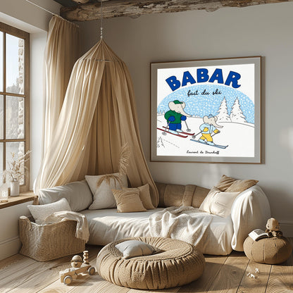 A horizontal children's art print featuring two cartoon elephants skiing down a white hill from left to right. The larger elephant, Babar, is in a green jacket with red skis. The smaller elephant is in a light blue jacket with blue skis. A large blue arch in the background represents a sky filled with white snow. Bold blue text at the top reads "BABAR" and script text below it says "fait du ski." The name "Laurent de Brunhoff" is centered at the bottom.