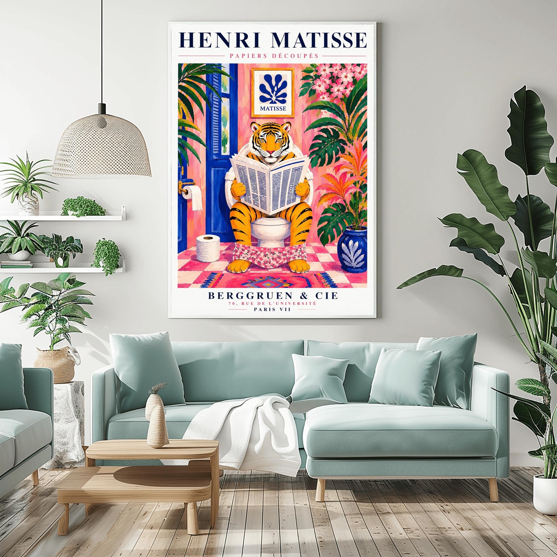 A vertical art print styled as a Henri Matisse exhibition poster. In the center, a tiger sits on a toilet in a pink bathroom, reading a newspaper with pink floral pants at its ankles. The room is decorated with lush tropical plants, a blue door, and a small Matisse-style blue cutout art piece on the wall. The text "HENRI MATISSE" is at the top, and "BERGGRUEN & CIE" is at the bottom.
