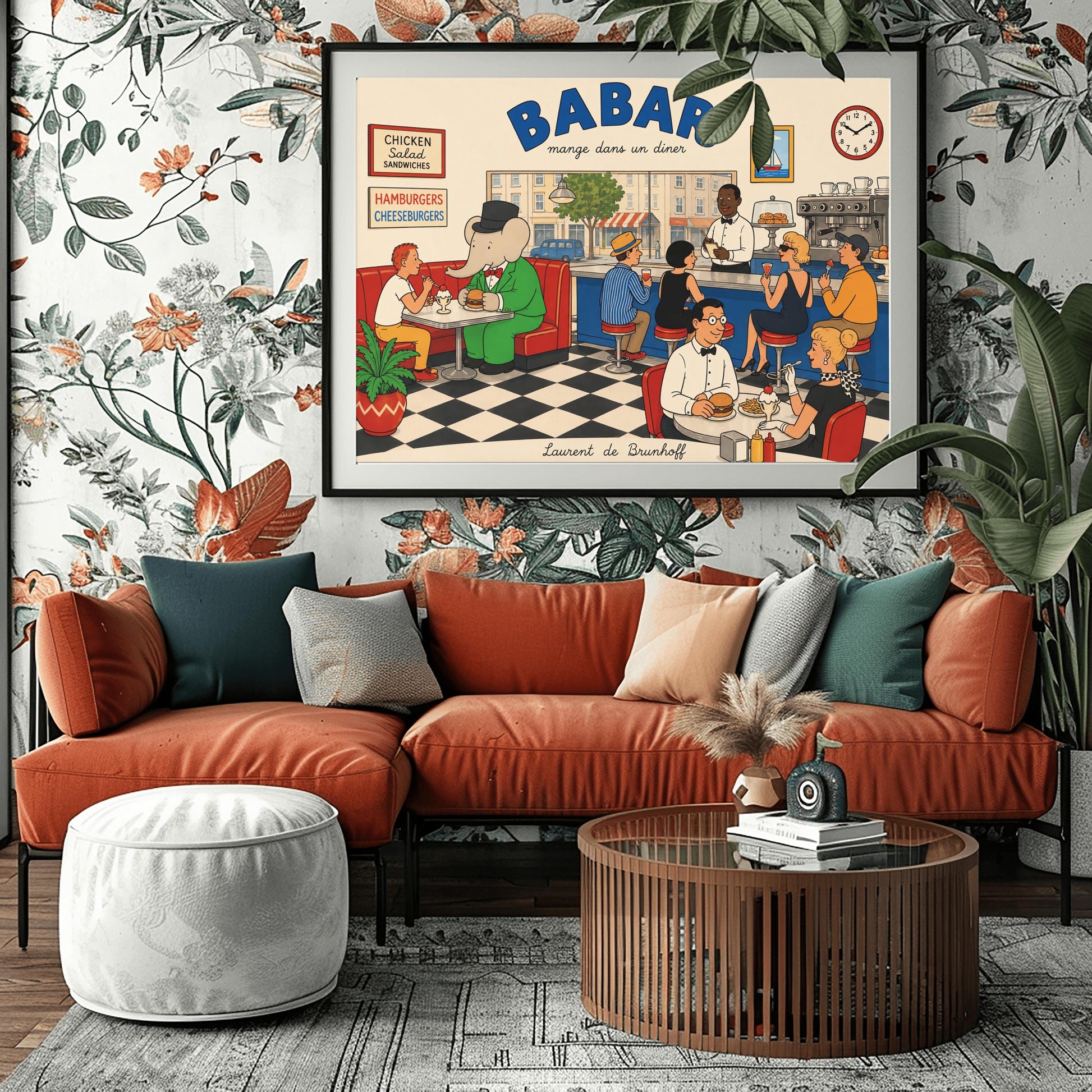 A colorful 1950s-style illustration poster titled "BABAR mange dans un diner" in bold blue and black lettering. The scene shows the interior of a lively retro diner with a black-and-white checkered floor. On the left, the cartoon elephant King Babar sits in a red leather booth wearing a green suit and top hat while eating a burger. Patrons sit at a long blue counter on stools and around tables eating burgers and sundaes, while a waiter takes orders.