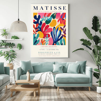 A vertical gallery exhibition poster with a warm cream border. Bold black text at the top reads "HENRI MATISSE". The central artwork is a rectangular block with a solid cobalt blue background, featuring a cream silhouette of an abstract, organic split-leaf design. Below the block, black text reads "PAPIERS DÉCOUPÉS" and "FEUILLE". The bottom of the poster finishes with the text "BERGGRUEN & CIE - 70 RUE DE L'UNIVERSITÉ - PARIS VII".