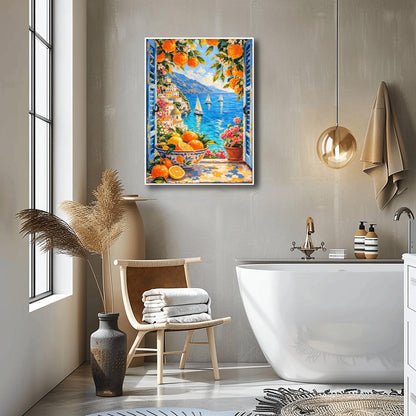 A vertical painterly illustration looking through open blue shutters at a coastal town with a yellow-domed cathedral and a blue sea with sailboats. In the foreground, a ceramic bowl holds oranges and lemons on a stone windowsill next to a pot of pink flowers.