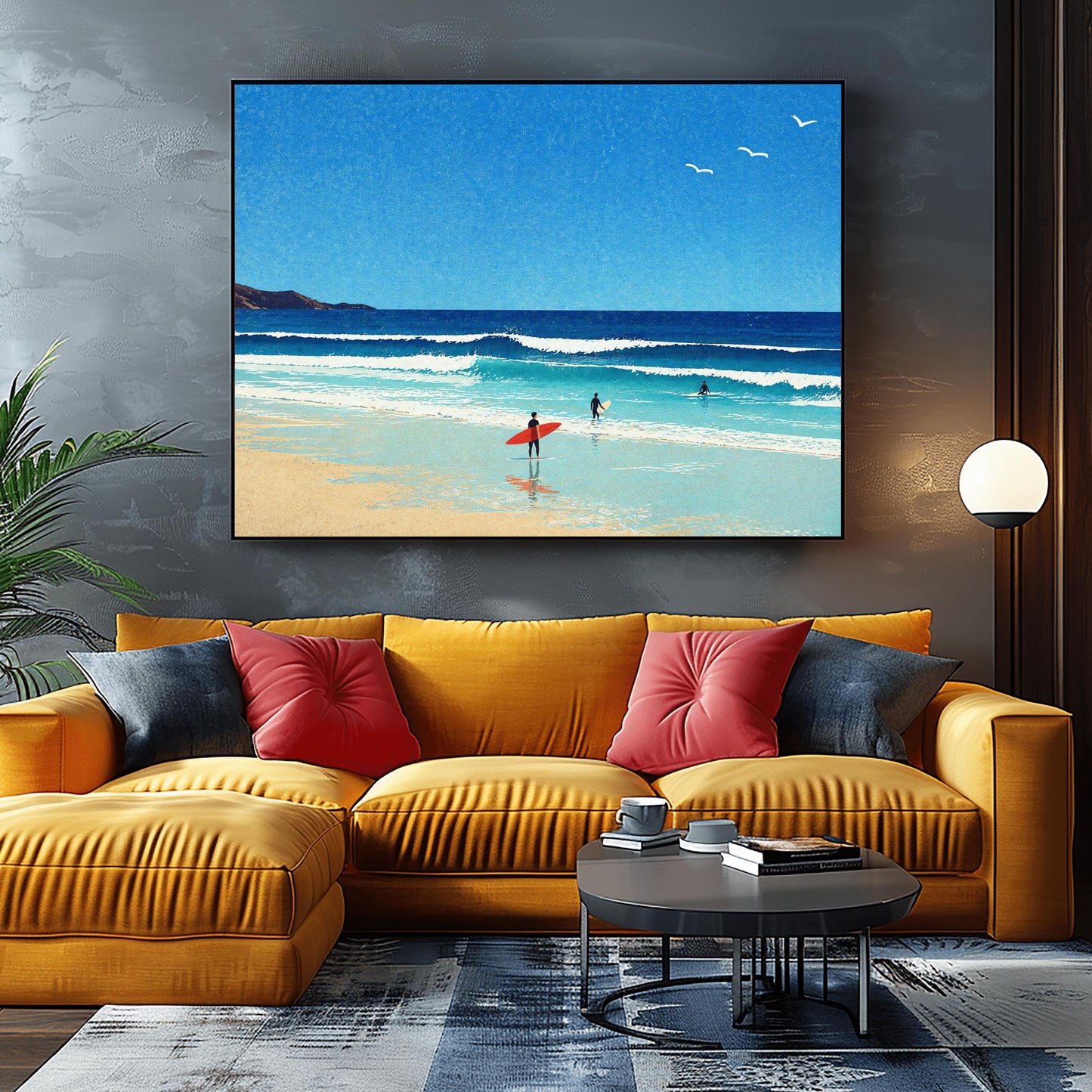 A horizontal minimalist art print of a bright beach day. A vast blue sky with three small white birds in flight sits above a turquoise ocean with gentle white waves. In the foreground, a sandy beach meets the water. A lone surfer in a black wetsuit holds a bright red surfboard on the shore, while two other surfers are further out in the water. A dark cliff is visible on the far left horizon. The style is clean and graphic with a subtle paper texture.