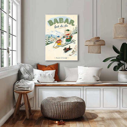 A vertical retro fine art exhibition poster titled "BABAR fait du ski" on a wide cream border. The illustration shows a large elephant and a small elephant skiing down a snowy slope wearing colorful patterned winter sweaters, accompanied by a small black dog in a plaid scarf. A snow-covered village and mountains are visible in the background, with the name "Laurent de Brunhoff" printed at the bottom.