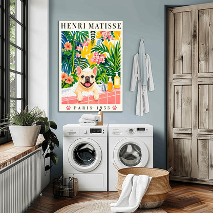 A vertical fine art exhibition poster in the style of Henri Matisse featuring a wide cream border. Bold black text reads "HENRI MATISSE" at the top and "PARIS 1953" at the bottom with two pink paw prints. The colorful painting inside depicts a cream French bulldog sitting in a bubble bath behind a pink tiled ledge, surrounded by a dense backdrop of green and blue tropical leaves, pink flowers, and yellow patterns.