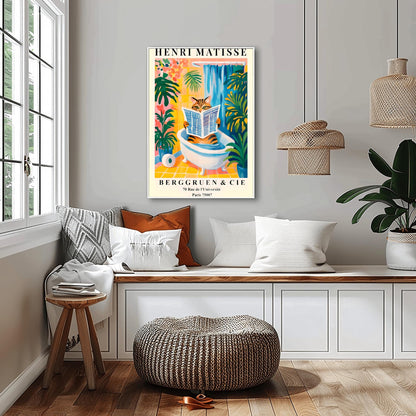 Living room with a funny Henri Matisse cat poster above a bench, surrounded by cushions and a plant.