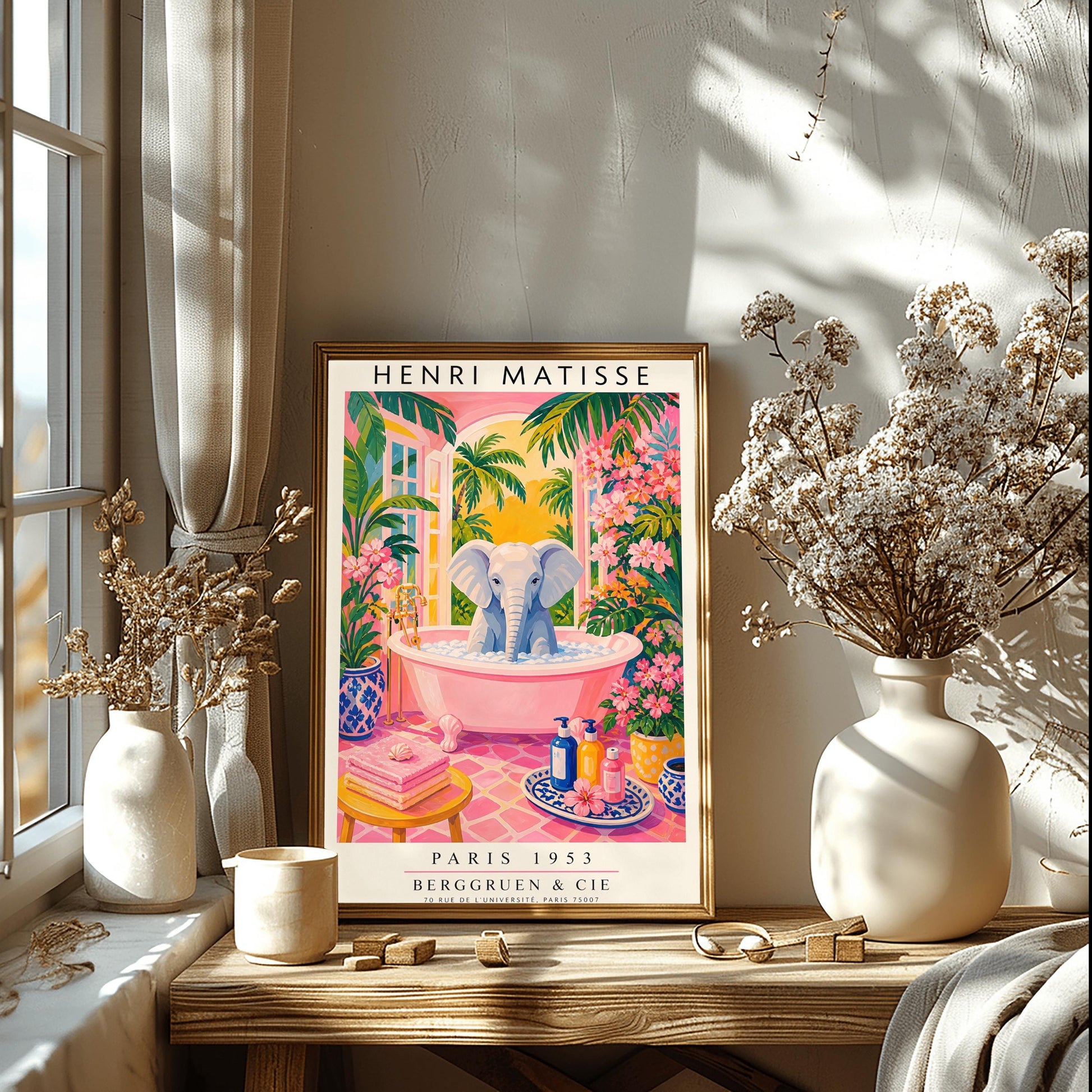 A vertical maximalist art print styled as a Henri Matisse exhibition poster. A light grey baby elephant is sitting in a large pink clawfoot bathtub filled with white bubbles. The bathroom features hot pink tiled floors, vibrant pink flowers, and lush green tropical plants. In the background, an arched window shows a bright golden sunset with palm tree silhouettes. A small yellow stool with towels and various blue and yellow ceramic vases decorate the room.