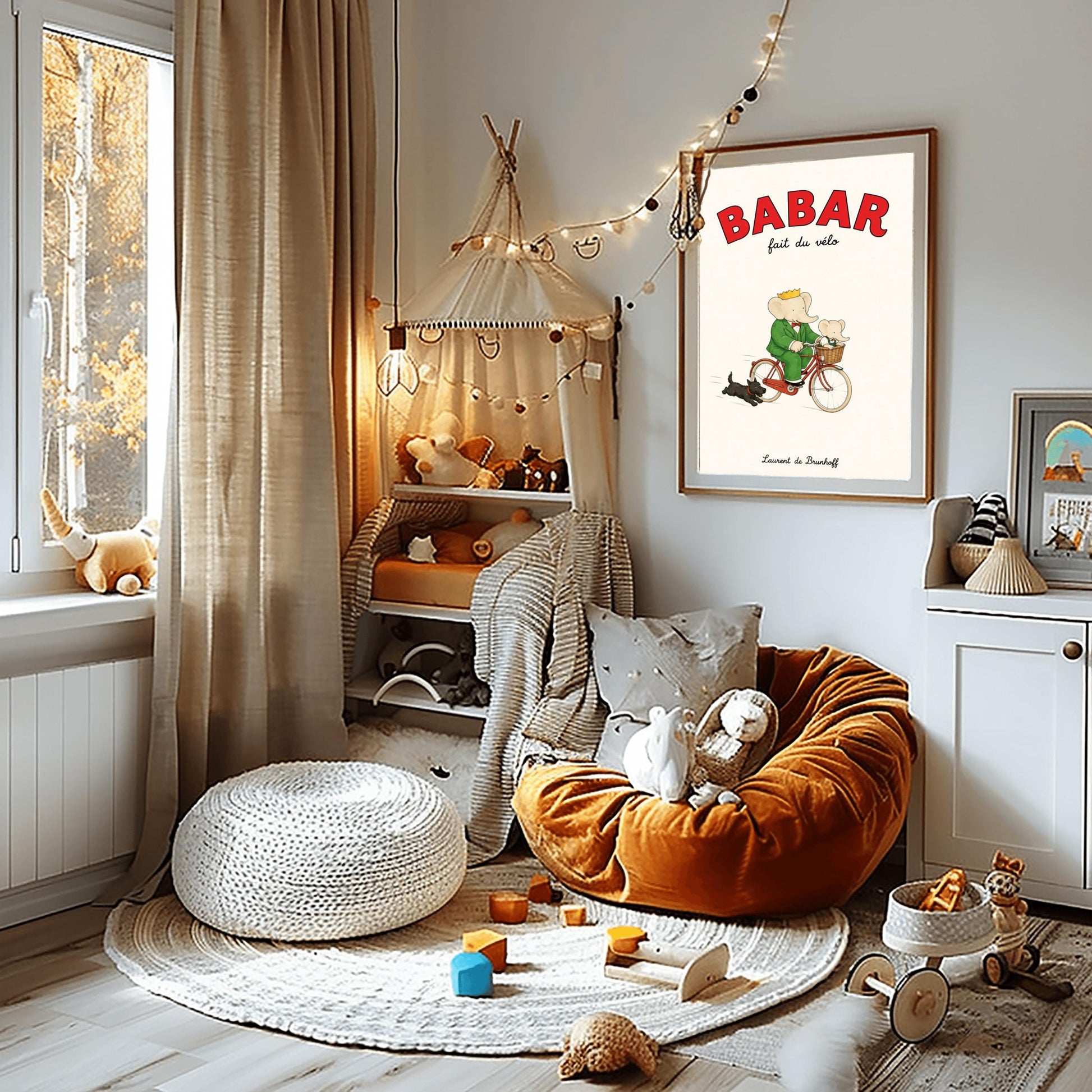 A vertical retro fine art exhibition poster titled "BABAR fait du vélo" on a wide cream border. The top "BABAR" text is printed in a bold red font. The illustration shows an elephant wearing a crown and green suit riding a vintage red bicycle. A smaller baby elephant is sitting inside a brown wicker basket on the handlebars, and a small black dog runs along beside the bike. The name "Laurent de Brunhoff" anchors the bottom.